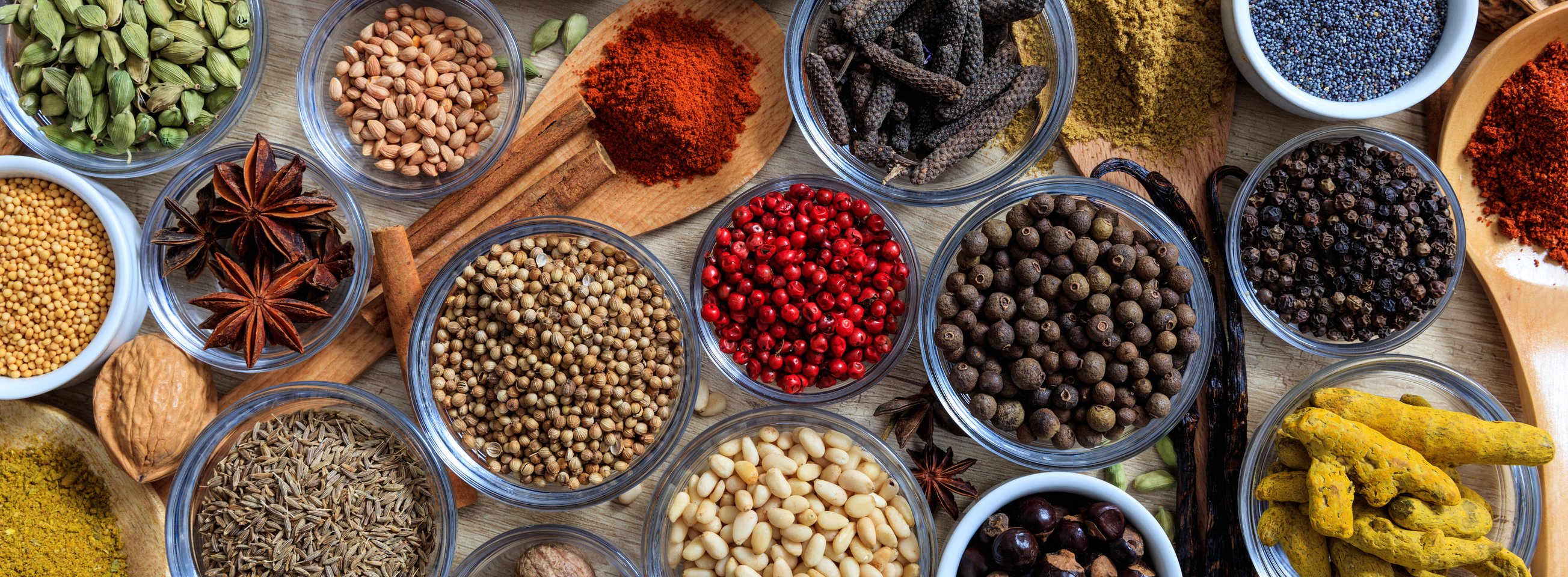 Spices and herbs. Colorful spices flat lay on wooden table